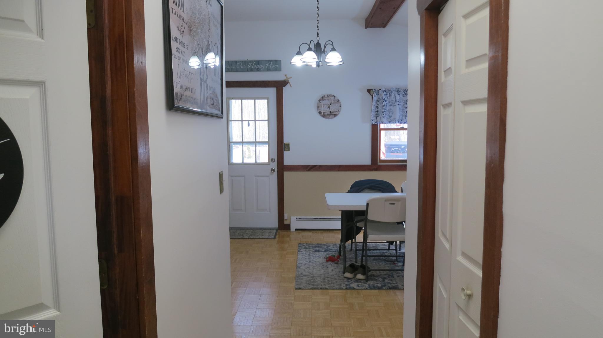 99 Lindbergh Road Hopewell, NJ 08525 - Photo 4 of 64 Inviting hallway leading to a cozy dining area.