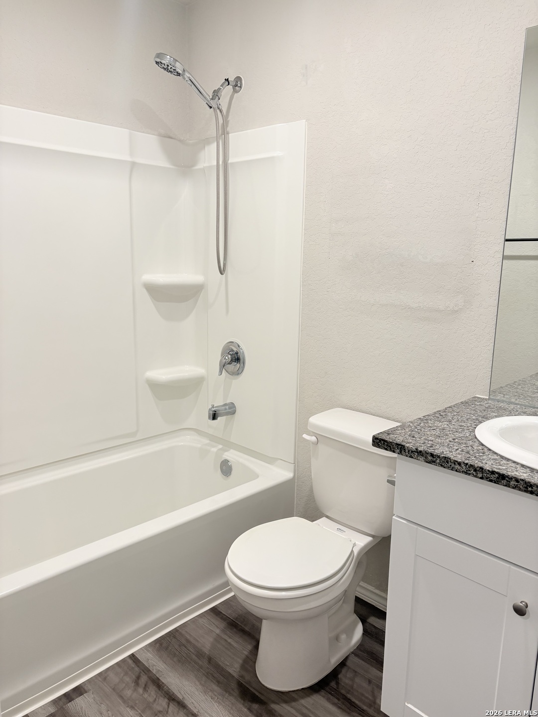 7022 Sunspot Converse, TX 78109 - Photo 11 of 18 a bathroom with a granite countertop bathtub shower sink vanity and toilet