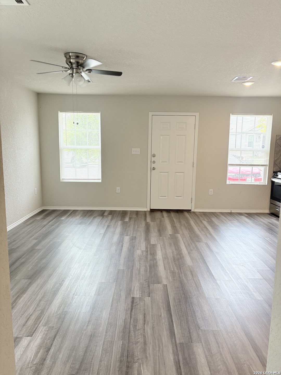 7022 Sunspot Converse, TX 78109 - Photo 5 of 18 wooden floor in an empty room with a window