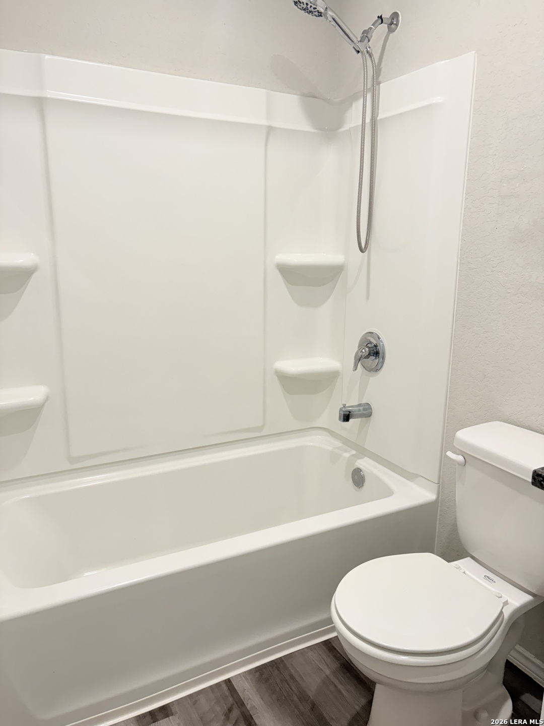7022 Sunspot Converse, TX 78109 - Photo 10 of 18 a bathroom with a toilet and a bathtub