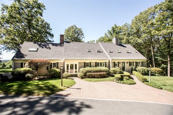 85 Myles Standish Road Weston, MA 02493 - Photo 1 of 28 a front view of a house with a yard and potted plants