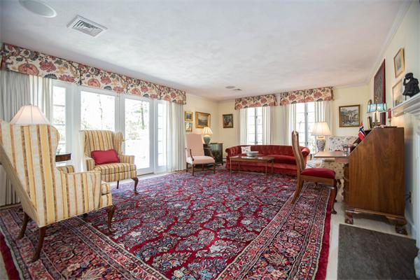 85 Myles Standish Road Weston, MA 02493 - Photo 11 of 28 a living room with furniture windows and a flat screen tv
