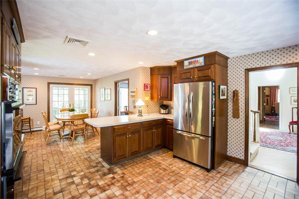 85 Myles Standish Road Weston, MA 02493 - Photo 14 of 28 a large kitchen with lots of counter space and stainless steel appliances