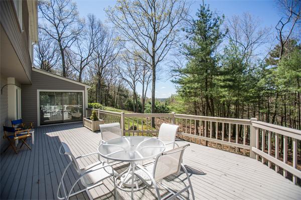 85 Myles Standish Road Weston, MA 02493 - Photo 16 of 28 a view of a patio with a yard