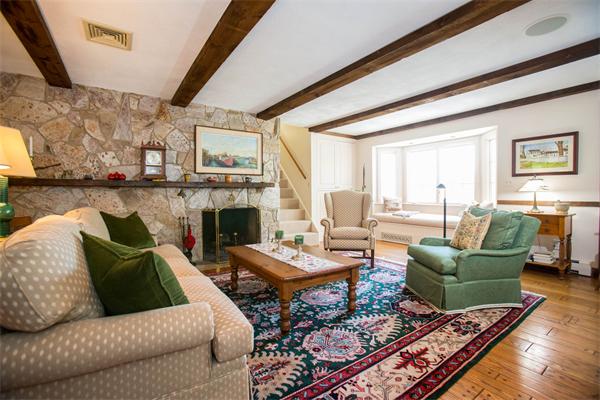 85 Myles Standish Road Weston, MA 02493 - Photo 20 of 28 a living room with furniture and a fireplace