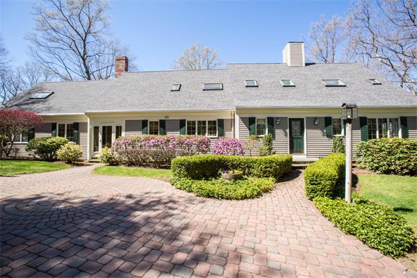 85 Myles Standish Road Weston, MA 02493 - Photo 2 of 28 a front view of a house with a yard and potted plants