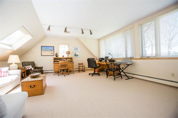 85 Myles Standish Road Weston, MA 02493 - Photo 23 of 28 a room with gym equipment and a large window
