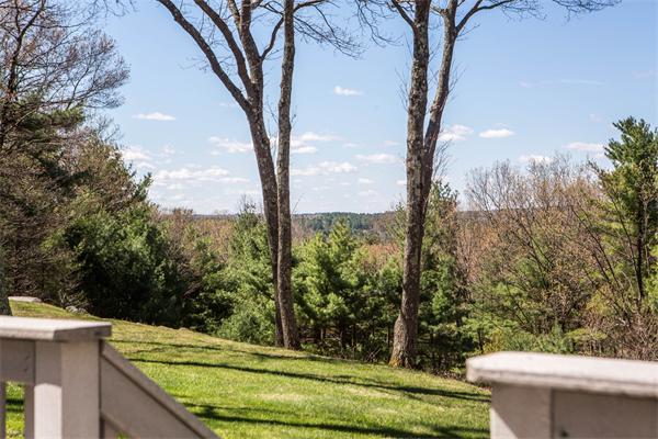 85 Myles Standish Road Weston, MA 02493 - Photo 4 of 28 a view of a sitting area with trees in the background