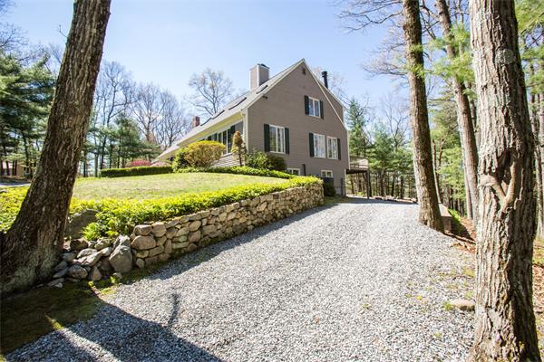 85 Myles Standish Road Weston, MA 02493 - Photo 5 of 28 a front view of a house with a yard and mountain view