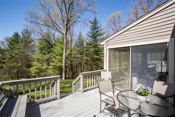 85 Myles Standish Road Weston, MA 02493 - Photo 7 of 28 a view of a chair and tables in the balcony