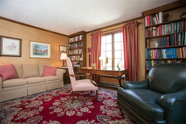 85 Myles Standish Road Weston, MA 02493 - Photo 10 of 28 a living room with furniture and a book shelf