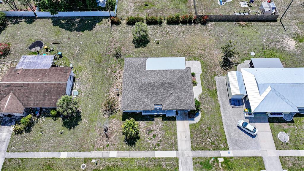 2166 Beacon Drive Port Charlotte, FL 33952 - Photo 2 of 36 an aerial view of houses with outdoor space