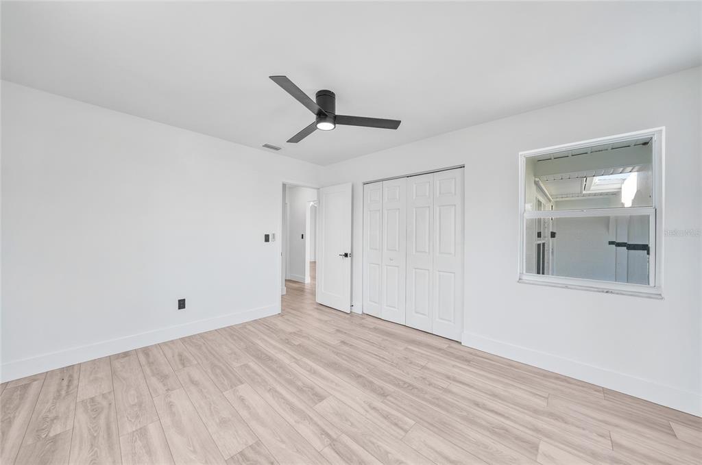2166 Beacon Drive Port Charlotte, FL 33952 - Photo 21 of 36 a view of a room with wooden floor and cabinet