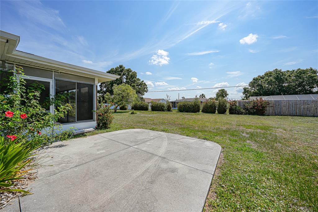 2166 Beacon Drive Port Charlotte, FL 33952 - Photo 27 of 36 a view of a garden with potted plants