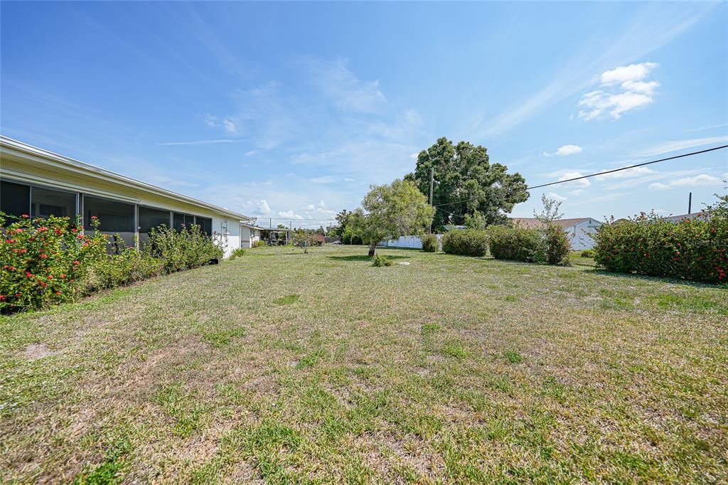 2166 Beacon Drive Port Charlotte, FL 33952 - Photo 30 of 36 a view of a backyard