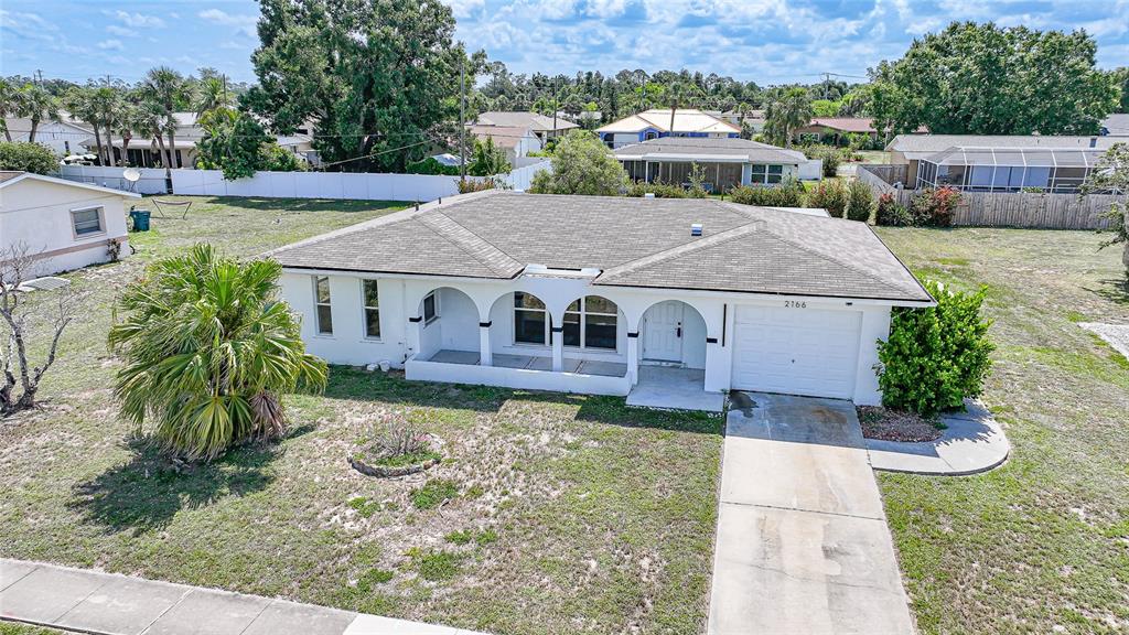 2166 Beacon Drive Port Charlotte, FL 33952 - Photo 33 of 36 an aerial view of a house with yard patio and swimming pool