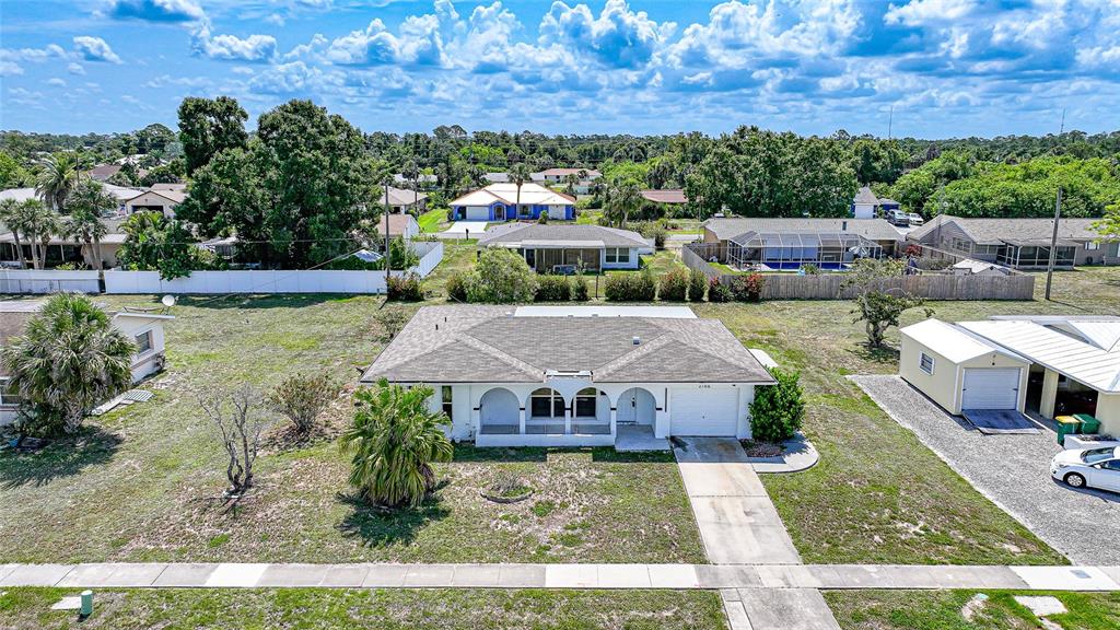 2166 Beacon Drive Port Charlotte, FL 33952 - Photo 34 of 36 an aerial view of a house with a big yard