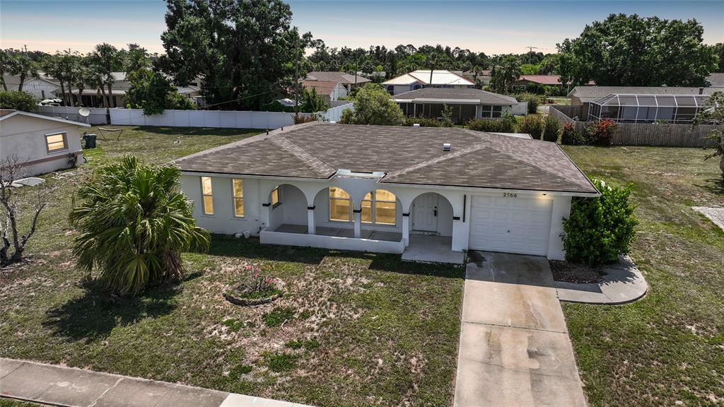 2166 Beacon Drive Port Charlotte, FL 33952 - Photo 35 of 36 an aerial view of a house with a yard
