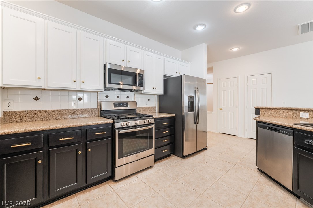 5389 Progresso Street Las Vegas, NV 89135 - Photo 1 of 41 A well-appointed kitchen features stainless steel appliances and abundant cabinetry.