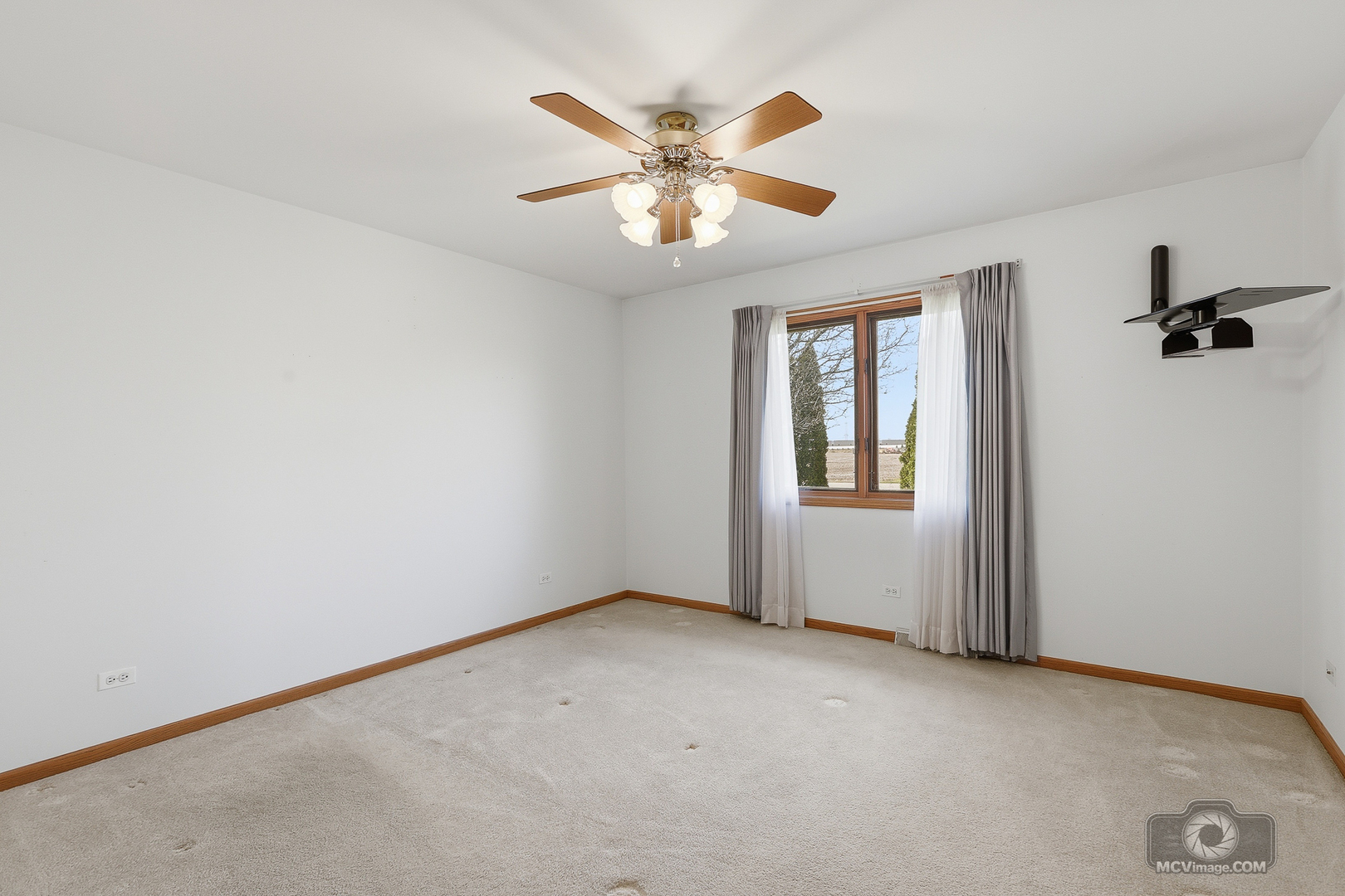 24711 South Sycamore Street Elwood, IL 60421 - Photo 16 of 38 an empty room with windows and fan