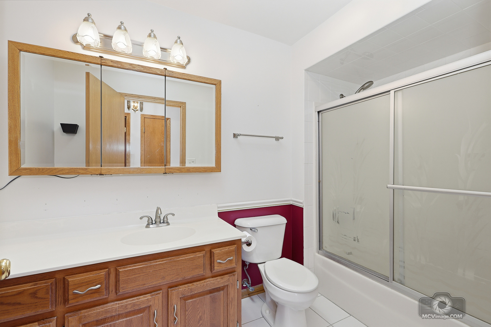 24711 South Sycamore Street Elwood, IL 60421 - Photo 17 of 38 a bathroom with a sink a toilet and shower