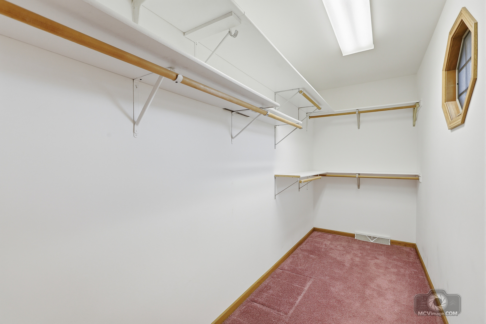 24711 South Sycamore Street Elwood, IL 60421 - Photo 19 of 38 a view of walk in closet with empty racks