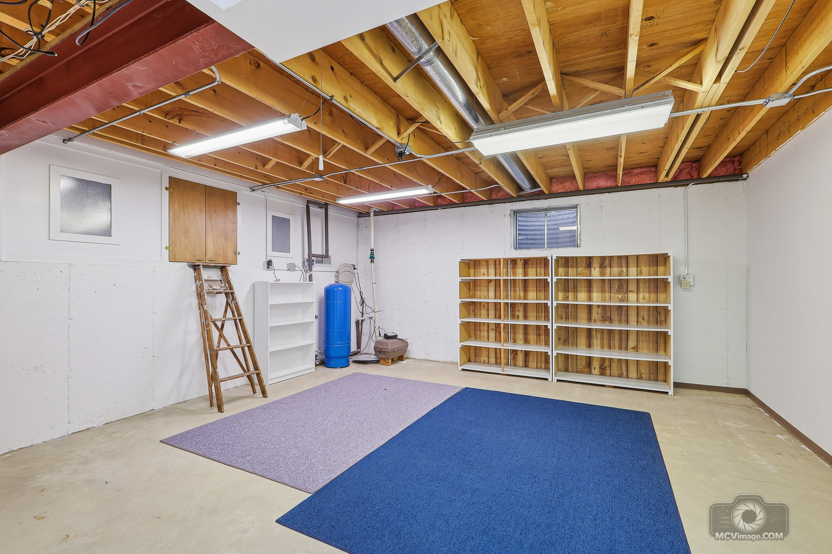 24711 South Sycamore Street Elwood, IL 60421 - Photo 21 of 38 a view of an empty room with a wooden floor and a window