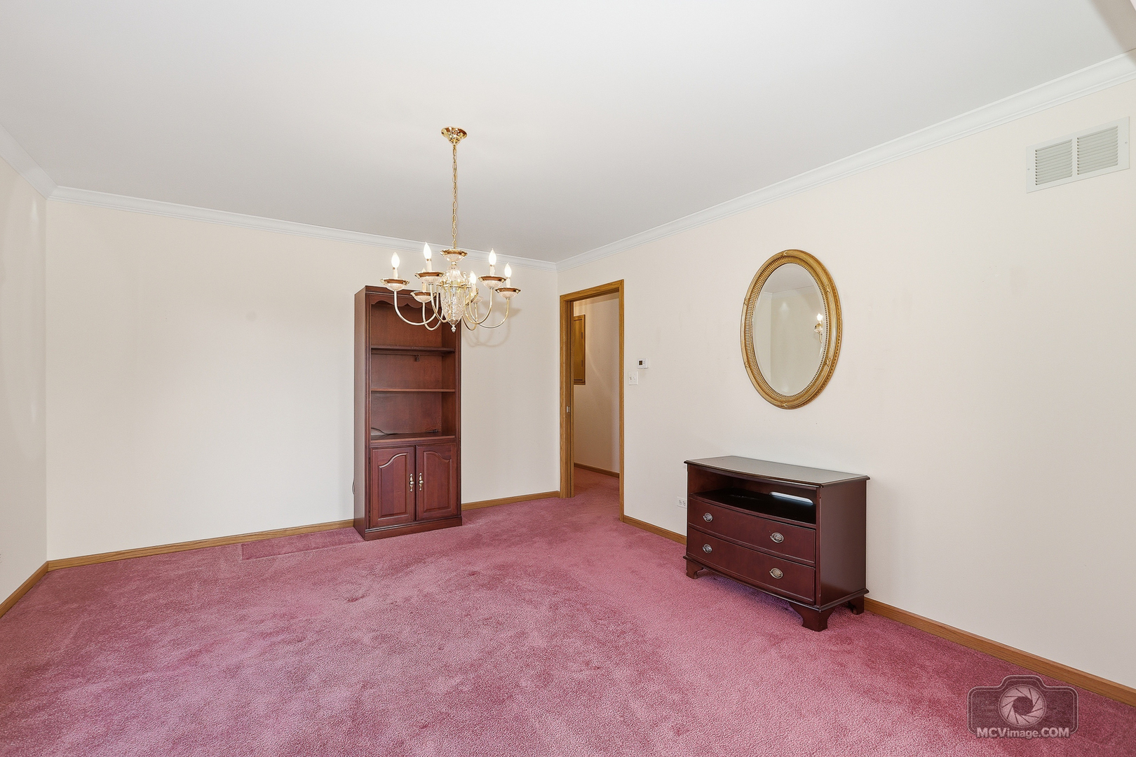 24711 South Sycamore Street Elwood, IL 60421 - Photo 6 of 38 a view of a room with a hanging light and kitchen
