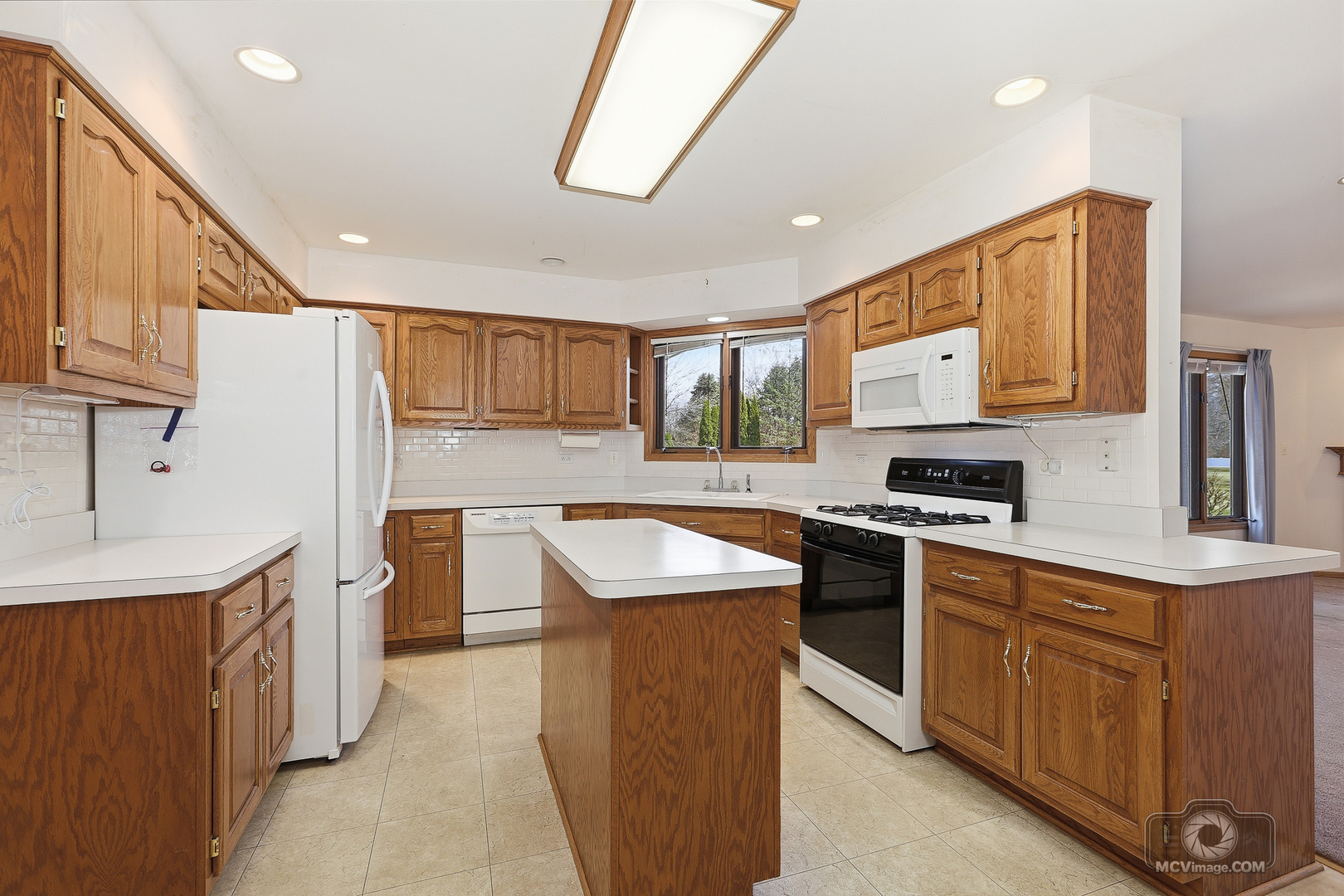24711 South Sycamore Street Elwood, IL 60421 - Photo 7 of 38 a kitchen with stainless steel appliances granite countertop a sink stove and refrigerator