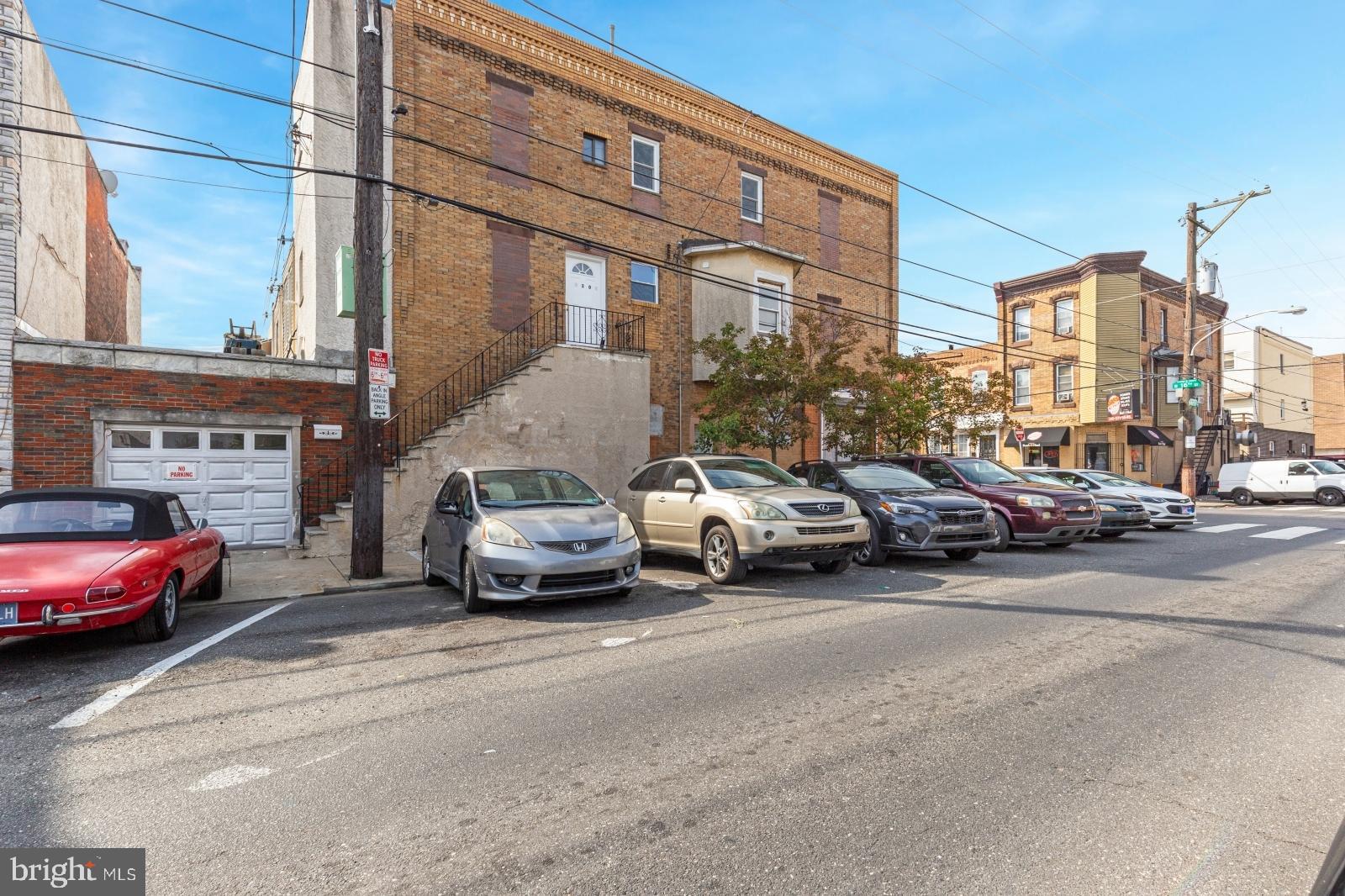 2301 South 16th Street, Unit 2 Philadelphia, PA 19145 - Photo 1 of 1 a car parked in front of a building
