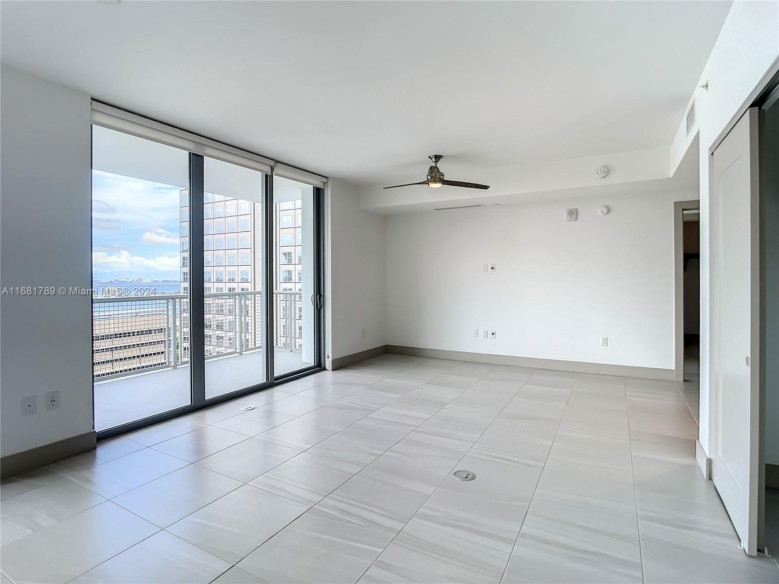 340 Southeast 3rd Street, Unit 1802 Miami, FL 33131 - Photo 15 of 36 a view of an empty room with a window