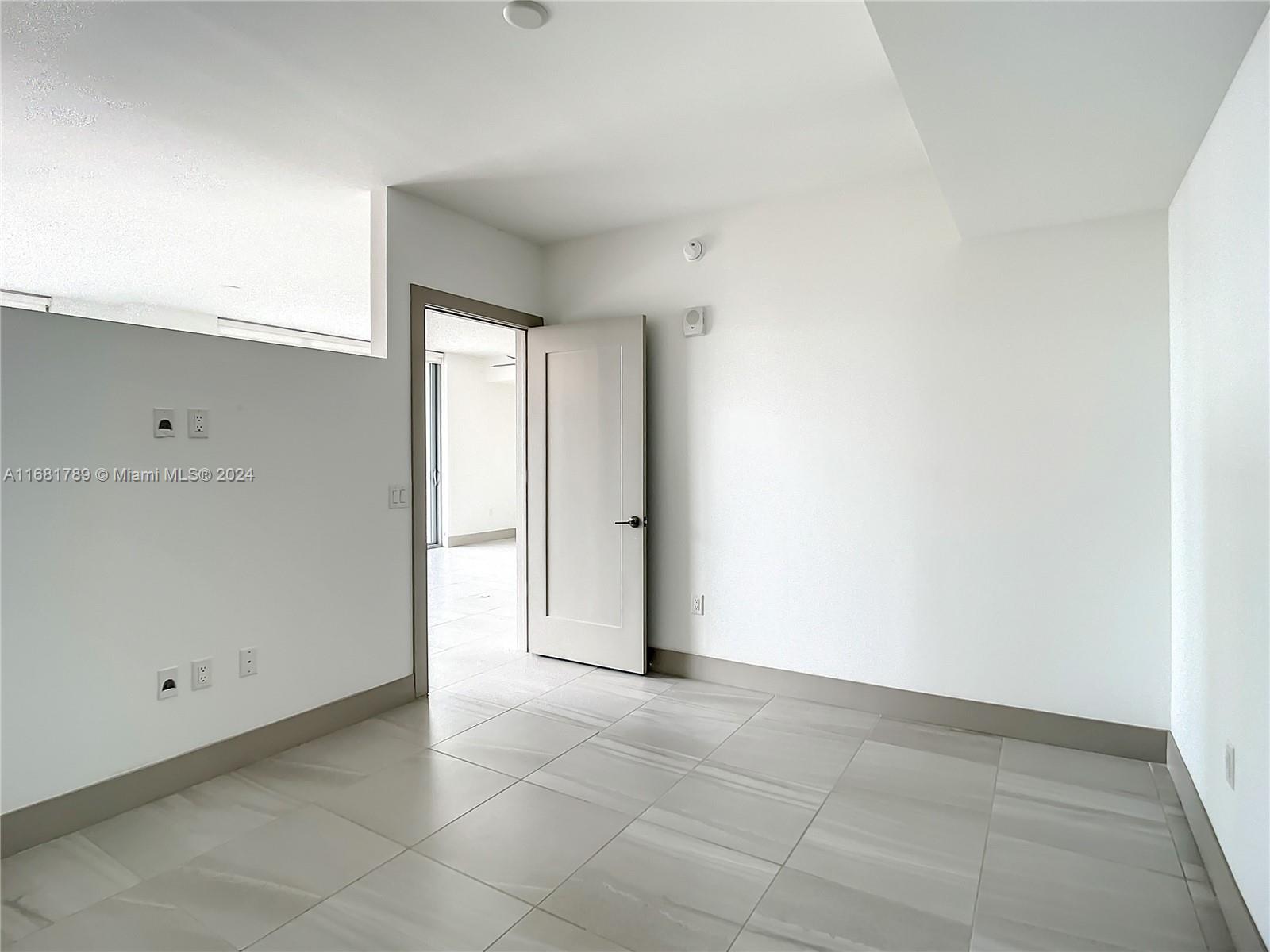 340 Southeast 3rd Street, Unit 1802 Miami, FL 33131 - Photo 16 of 36 a view of an empty room