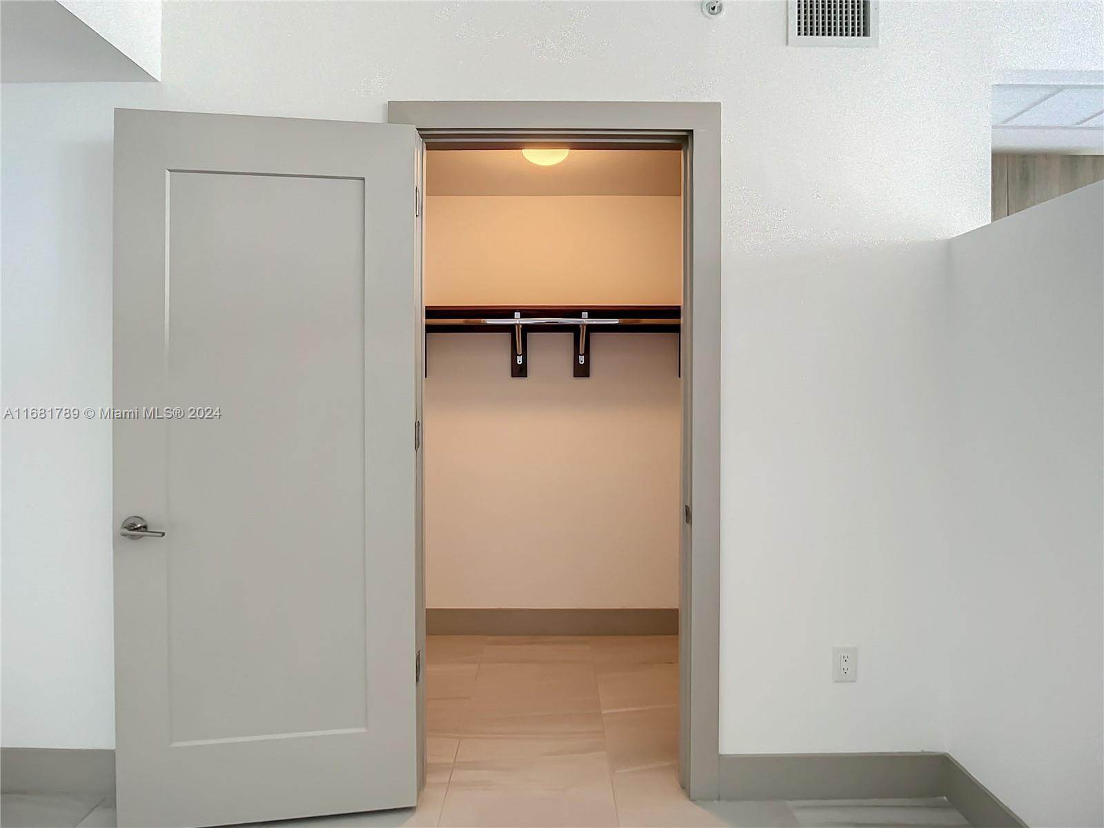 340 Southeast 3rd Street, Unit 1802 Miami, FL 33131 - Photo 18 of 36 a view of a hallway with closet