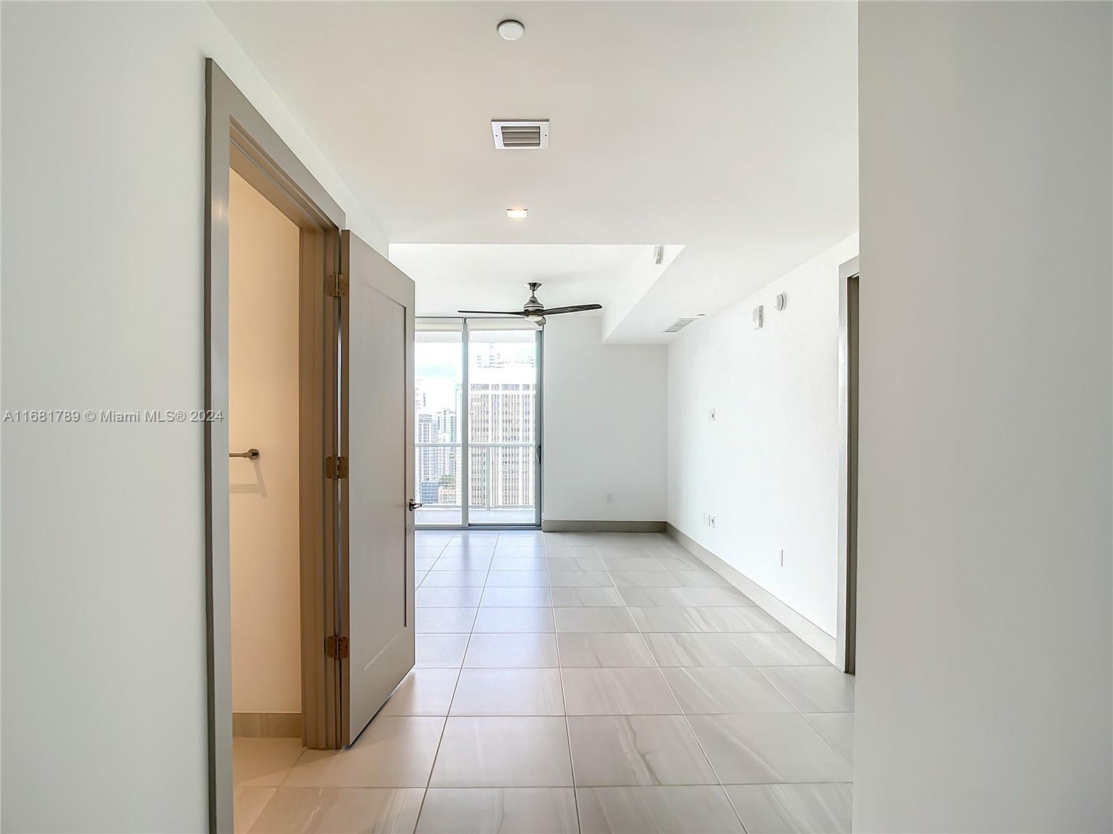 340 Southeast 3rd Street, Unit 1802 Miami, FL 33131 - Photo 4 of 36 a view of a hallway to rooms