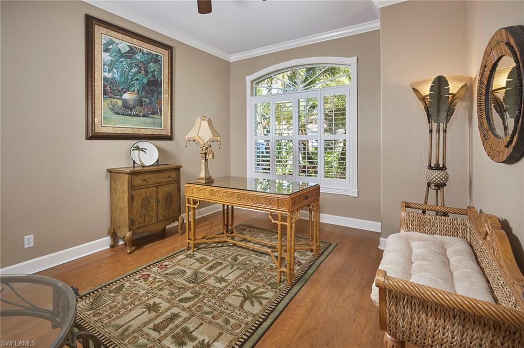 377 Mallory Court Naples, FL 34110 - Photo 14 of 29 a living room with furniture and a window