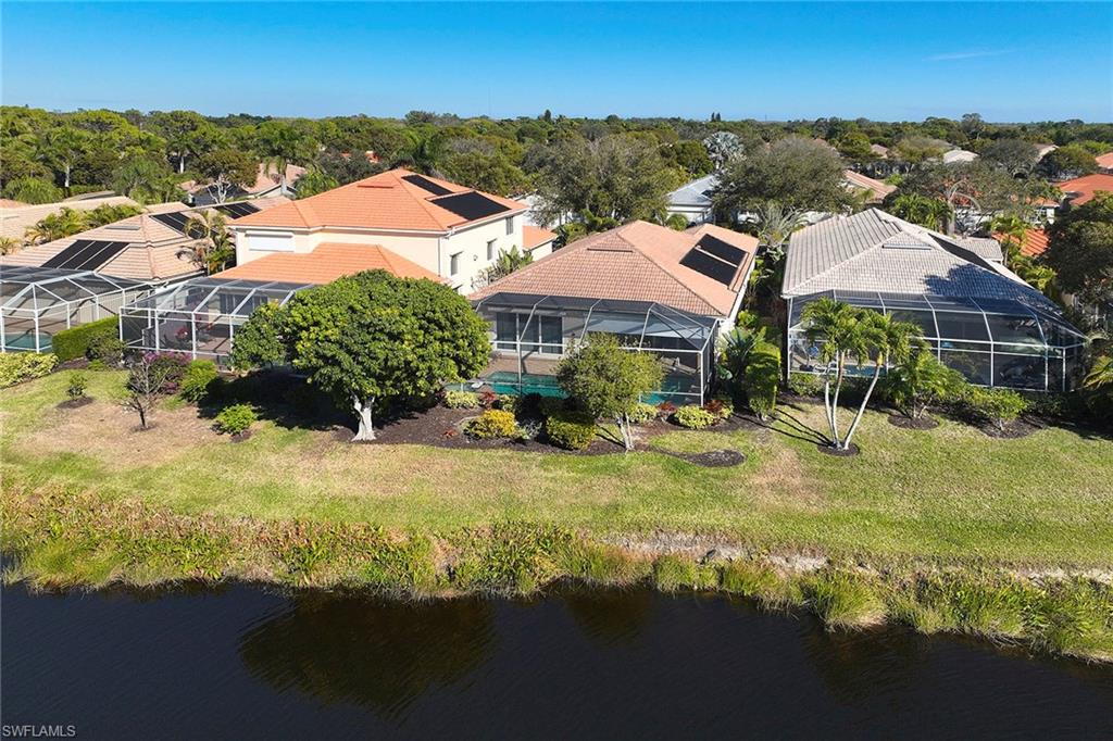 377 Mallory Court Naples, FL 34110 - Photo 29 of 29 a view of house with garden space and mountain view