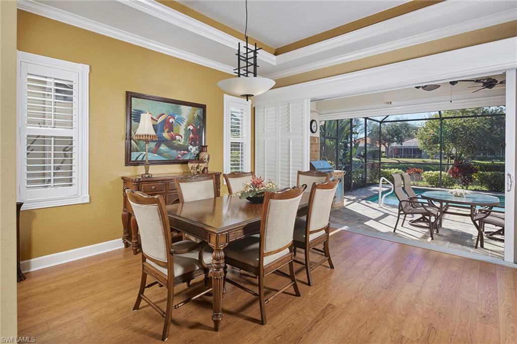 377 Mallory Court Naples, FL 34110 - Photo 4 of 29 a view of a dining room with furniture window and outside view