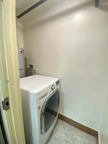 a bathroom with a toilet sink and shower