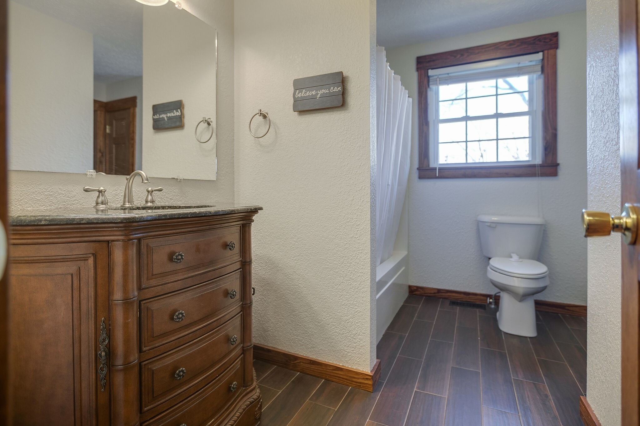 10997 Rials Branch Road Bon Aqua, TN 37025 - Photo 18 of 39 a bathroom with a toilet a sink and mirror