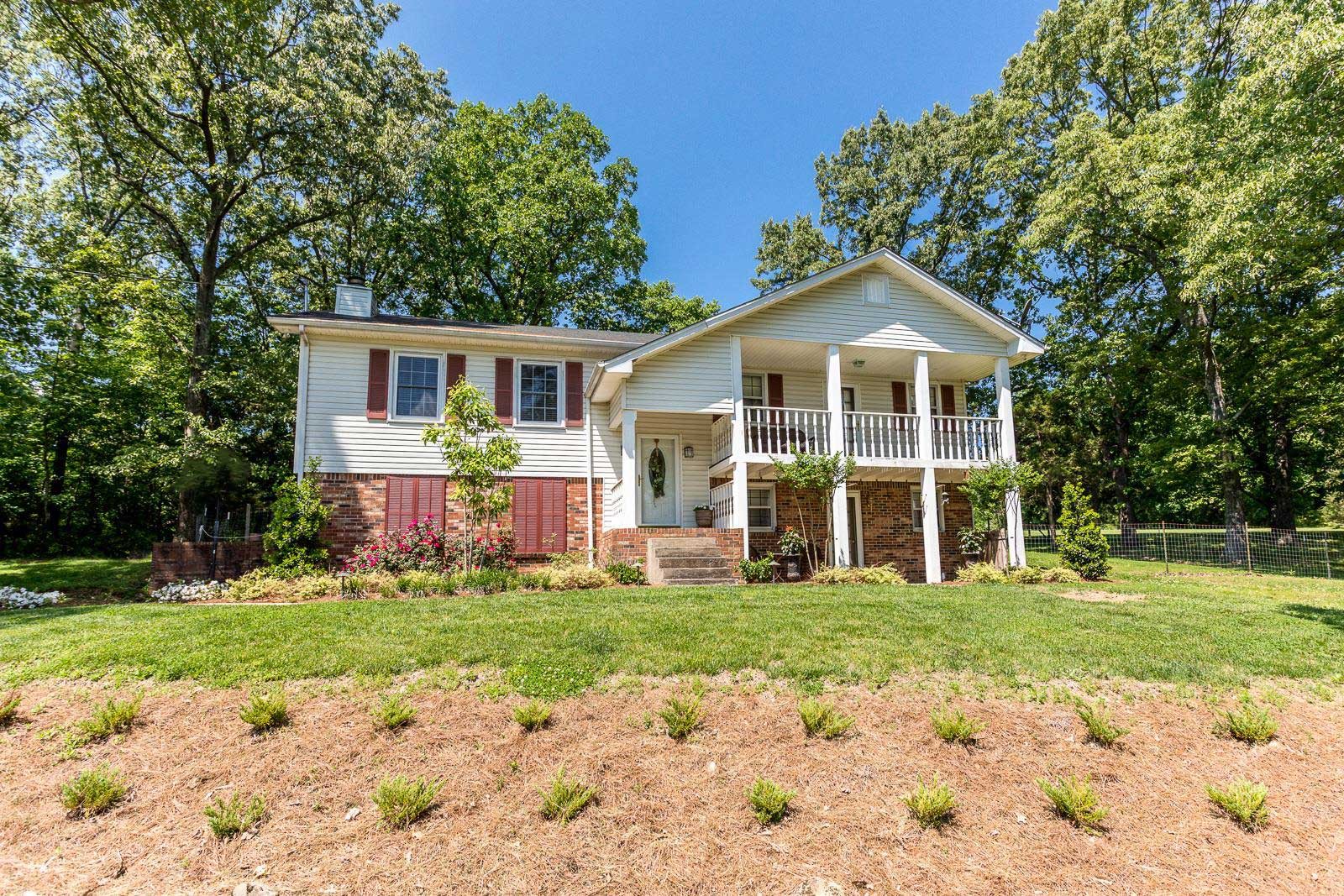 10997 Rials Branch Road Bon Aqua, TN 37025 - Photo 2 of 39 a view of a house with a yard