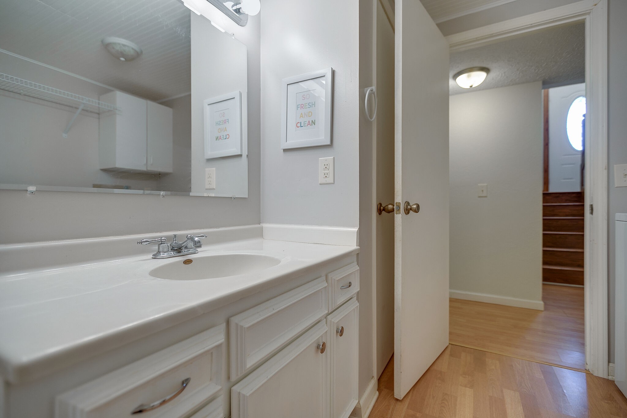 10997 Rials Branch Road Bon Aqua, TN 37025 - Photo 22 of 39 a bathroom with a sink and a mirror