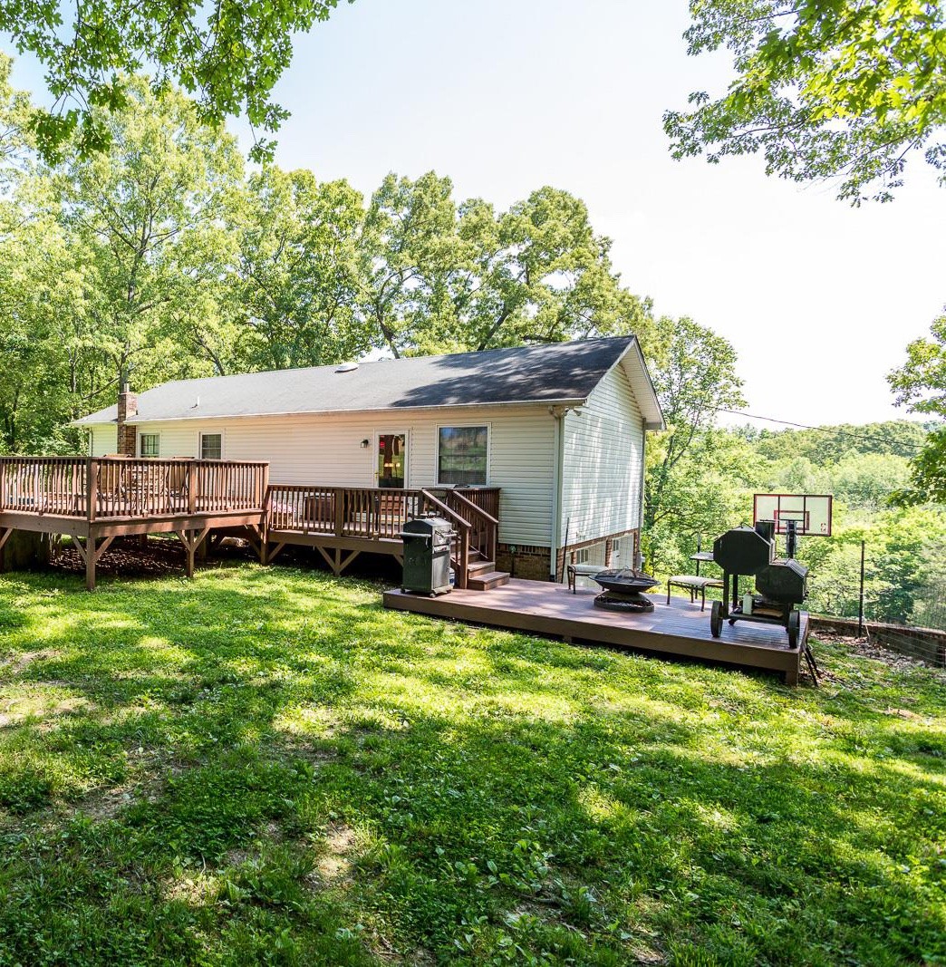 10997 Rials Branch Road Bon Aqua, TN 37025 - Photo 24 of 39 a view of a house with backyard and sitting area