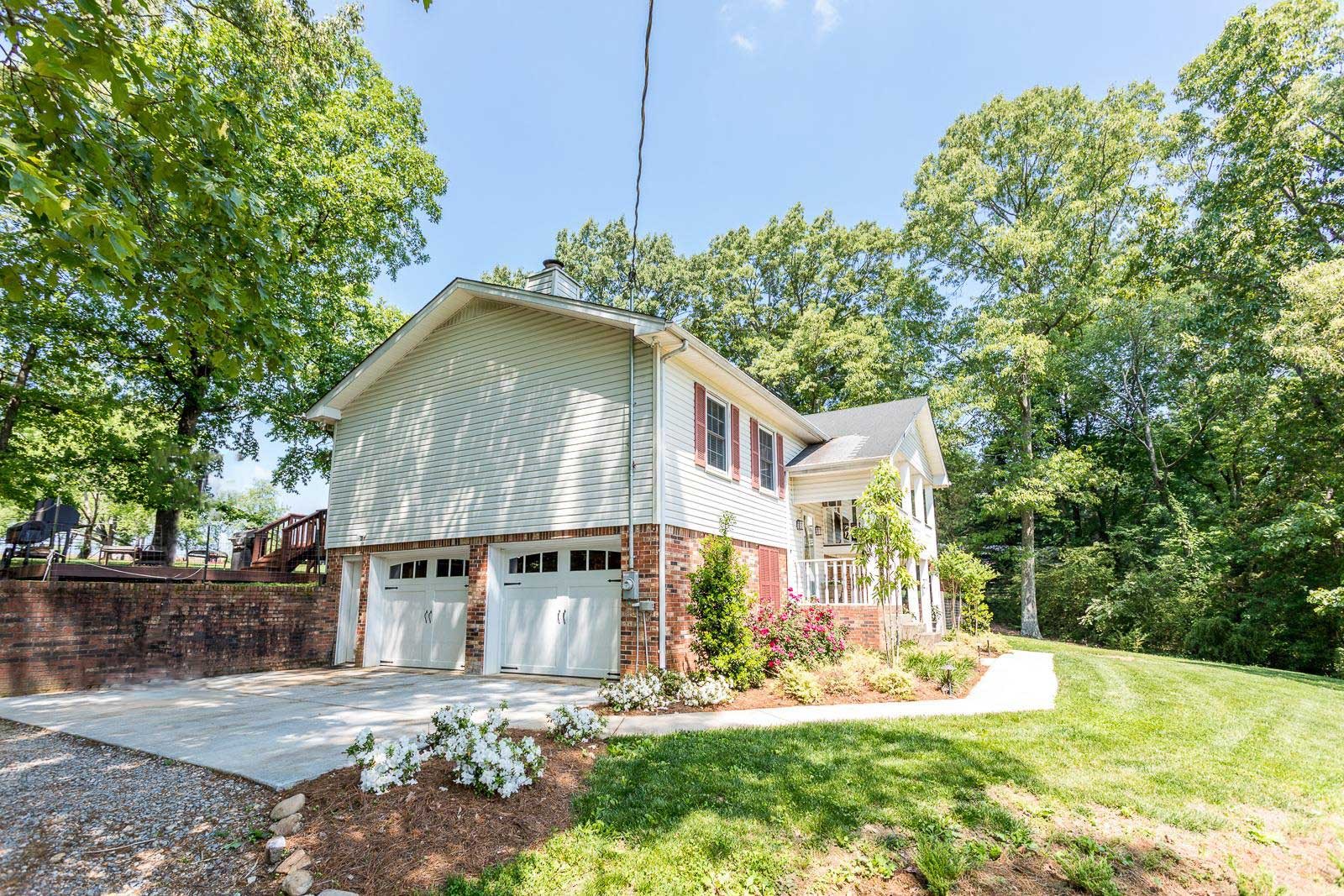 10997 Rials Branch Road Bon Aqua, TN 37025 - Photo 4 of 39 a house with trees in the background