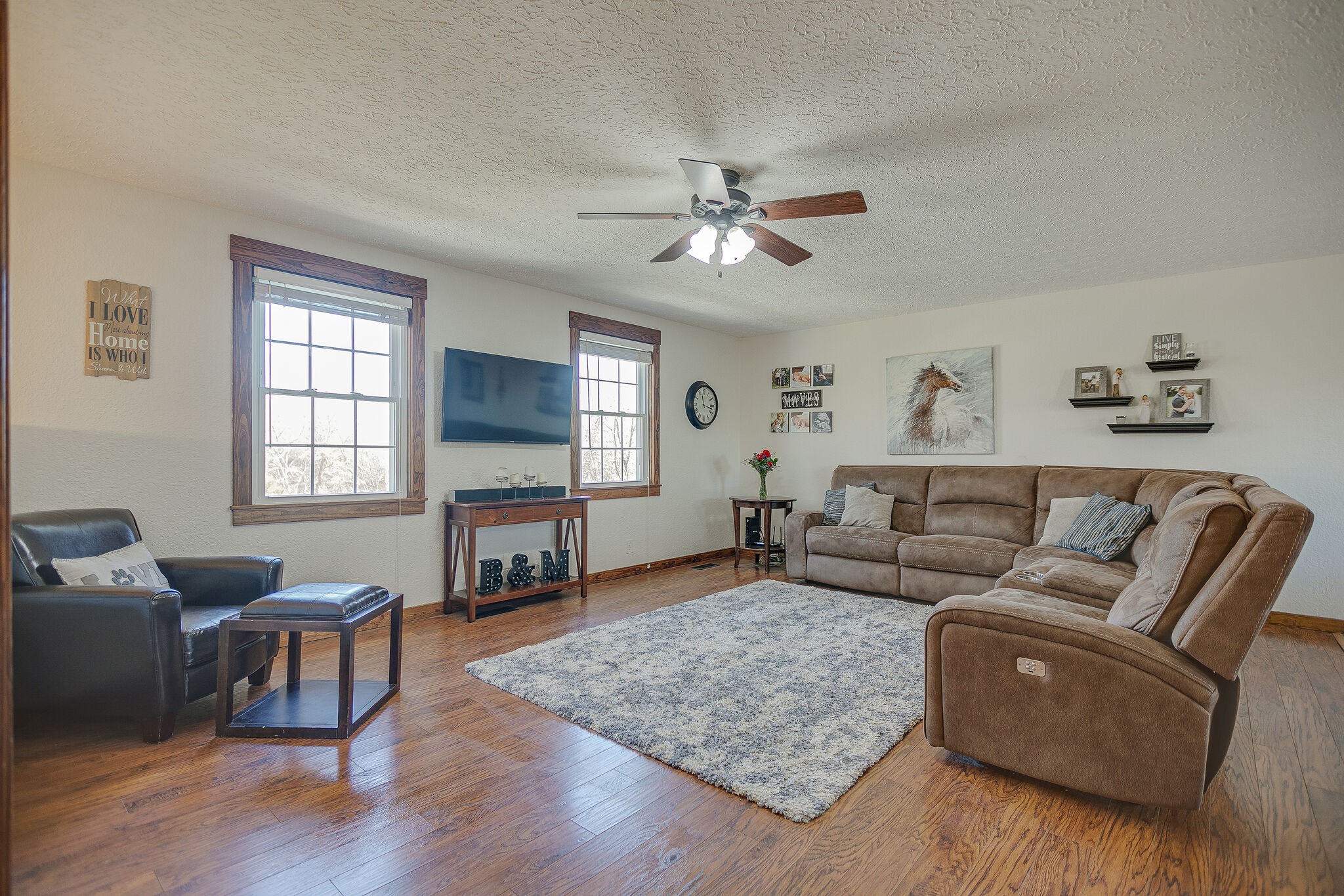 10997 Rials Branch Road Bon Aqua, TN 37025 - Photo 8 of 39 a living room with fireplace furniture and a flat screen tv