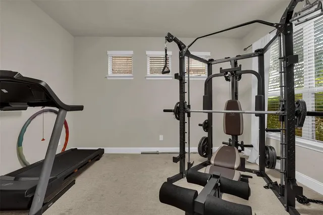 a view of kitchen with windows and furniture