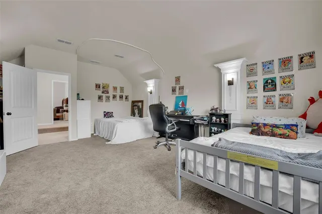 a bedroom with furniture and a window