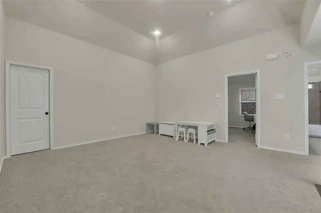 a bedroom with furniture and a book shelf