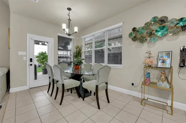 a kitchen with granite countertop a refrigerator and a sink