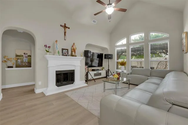 a view of a dining room with furniture and a chandelier