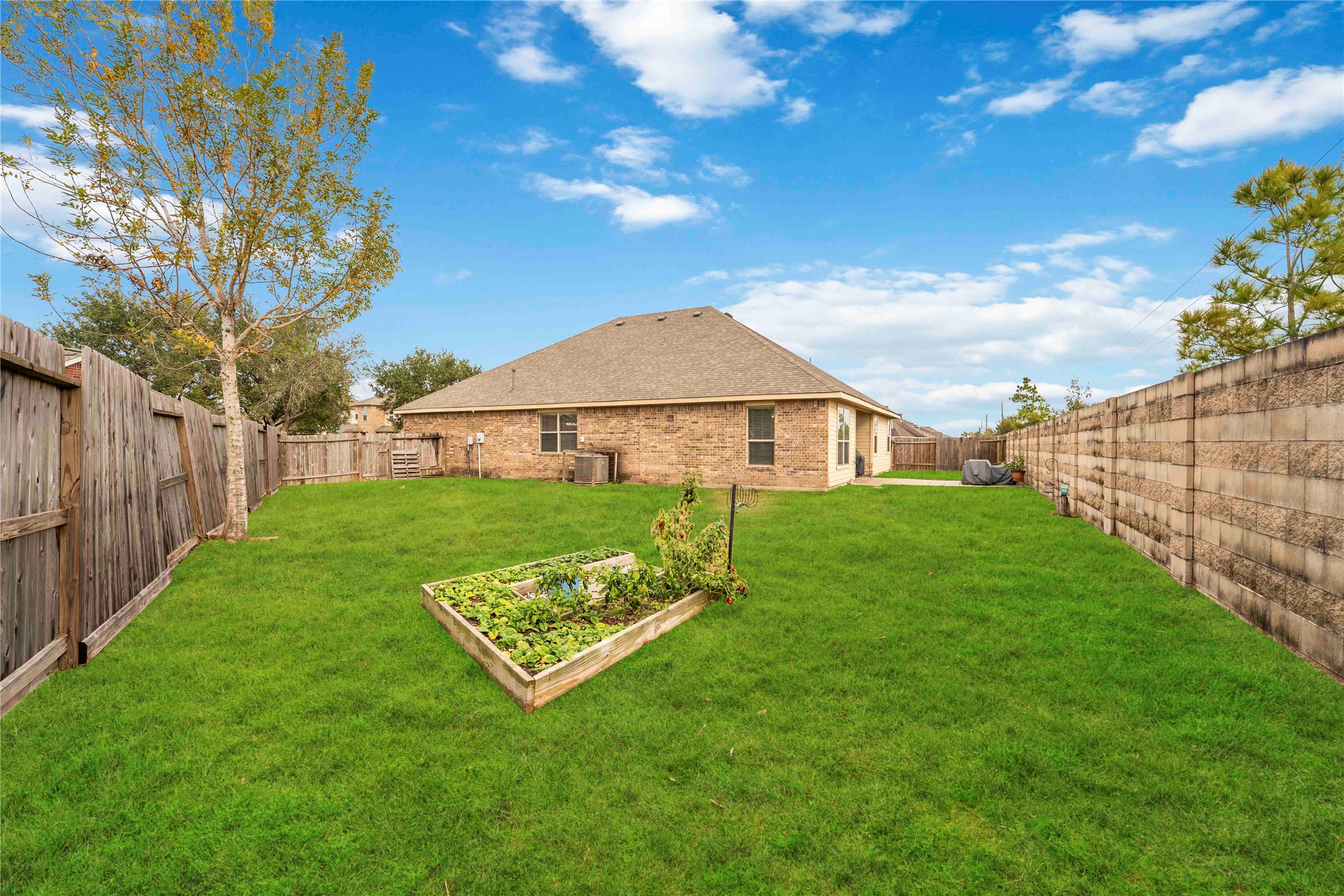 2502 Tiger Eye Drive Rosharon, TX 77583 - Photo 27 of 29 Enjoy your irrigated vegetable garden right in your own back yard. Also your back yard comes with an underground electric dog fence around the entire property.